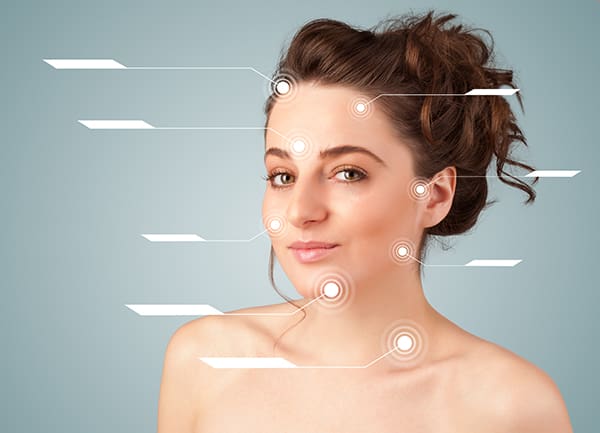 Young sexy girl with facial treatment modern arrows