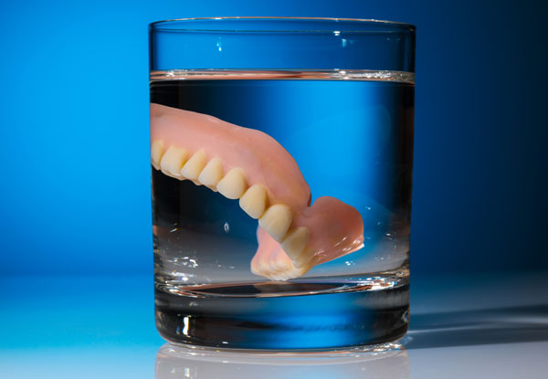dentures in a glass
